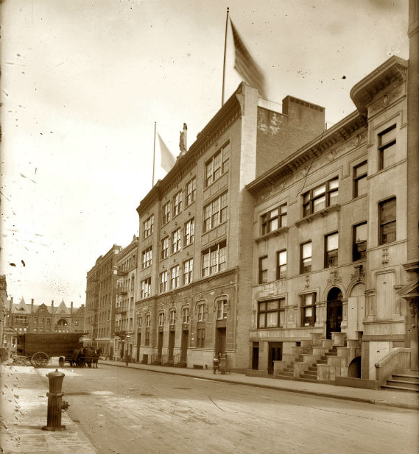 the building with the statue is the Our Lady of Lourdes School at 468 West 143rd Street in New York circa 1914